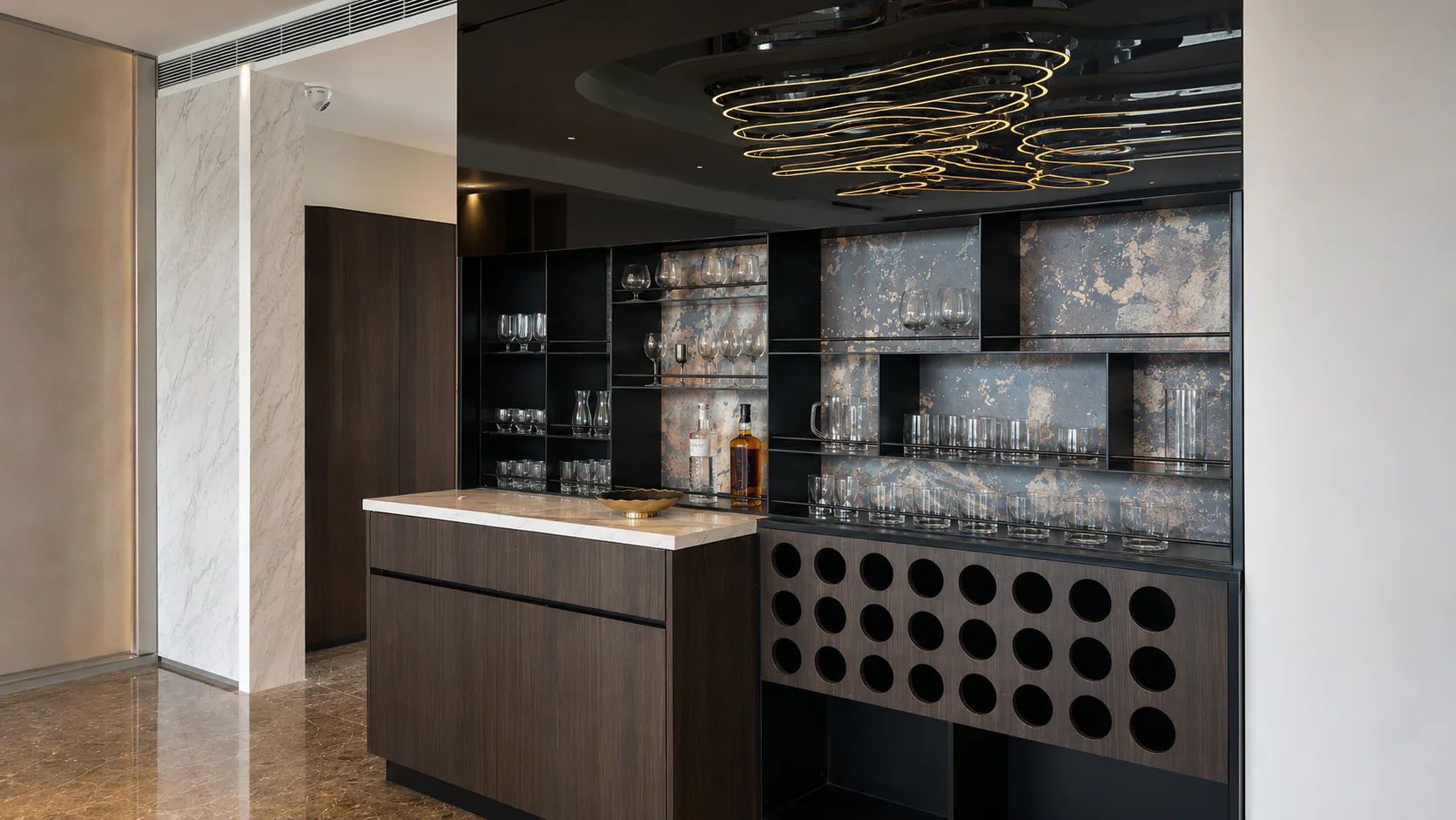 Bar display with glass-front shelving and a central counter.